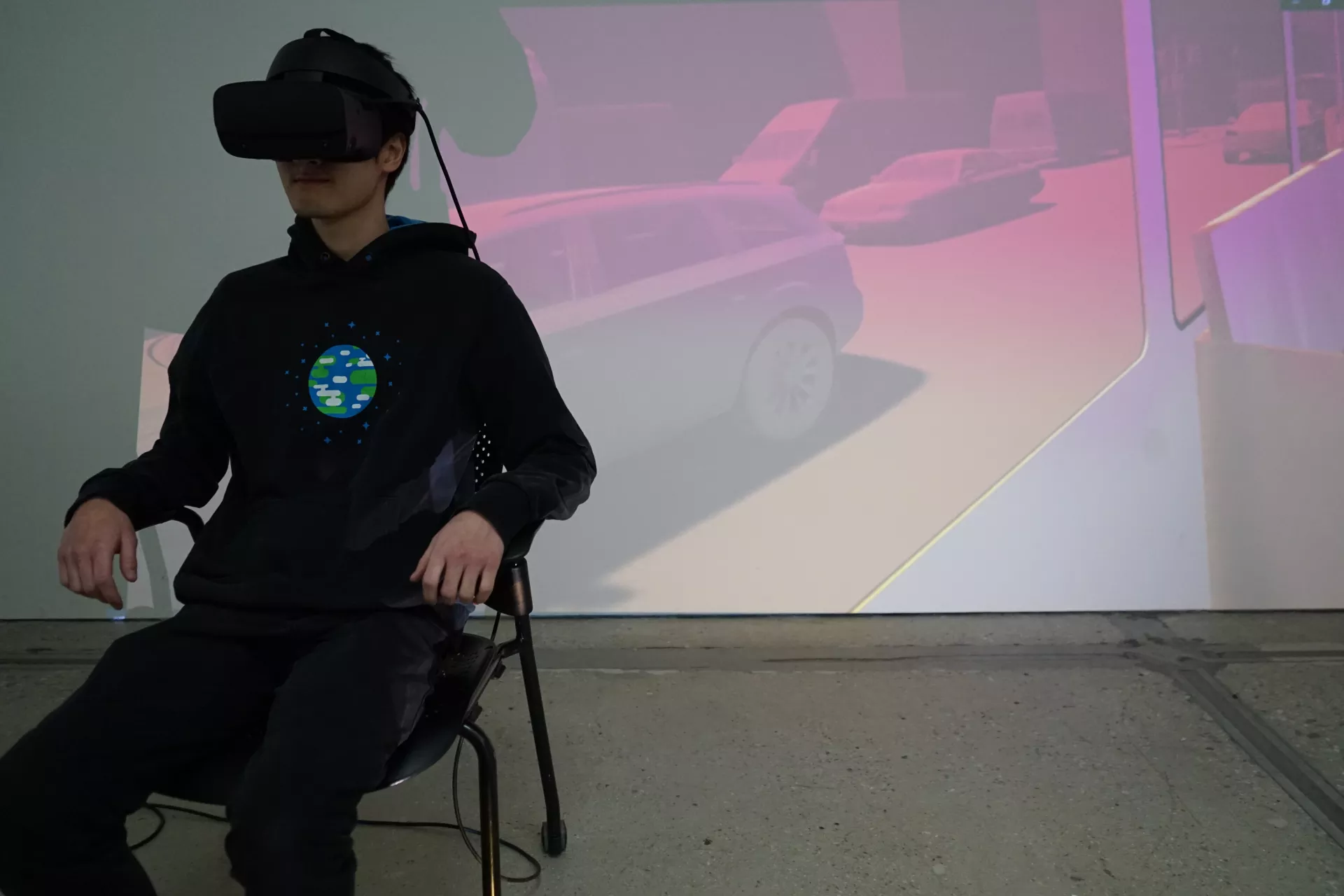 A photo showing a person interacting with the bus level for the experience