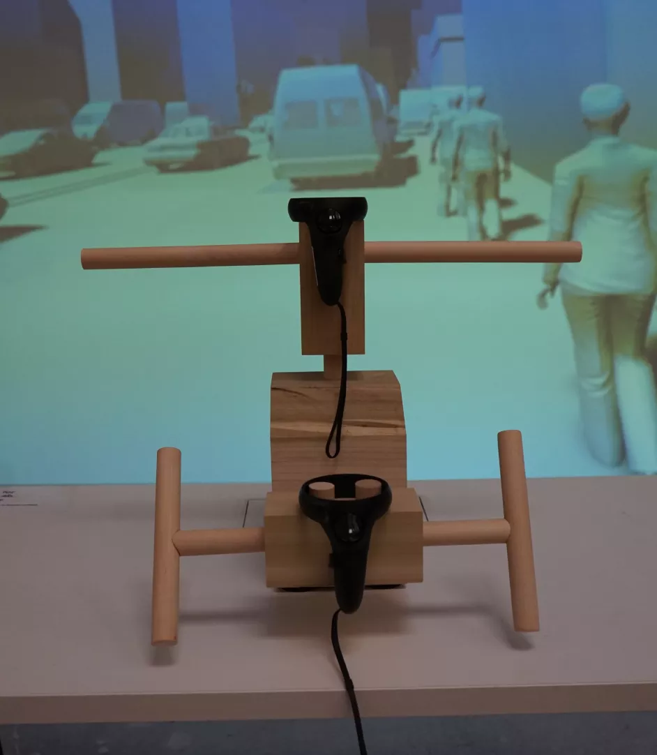 A hero shot of the prototype controller with the digital experience playing in the background
